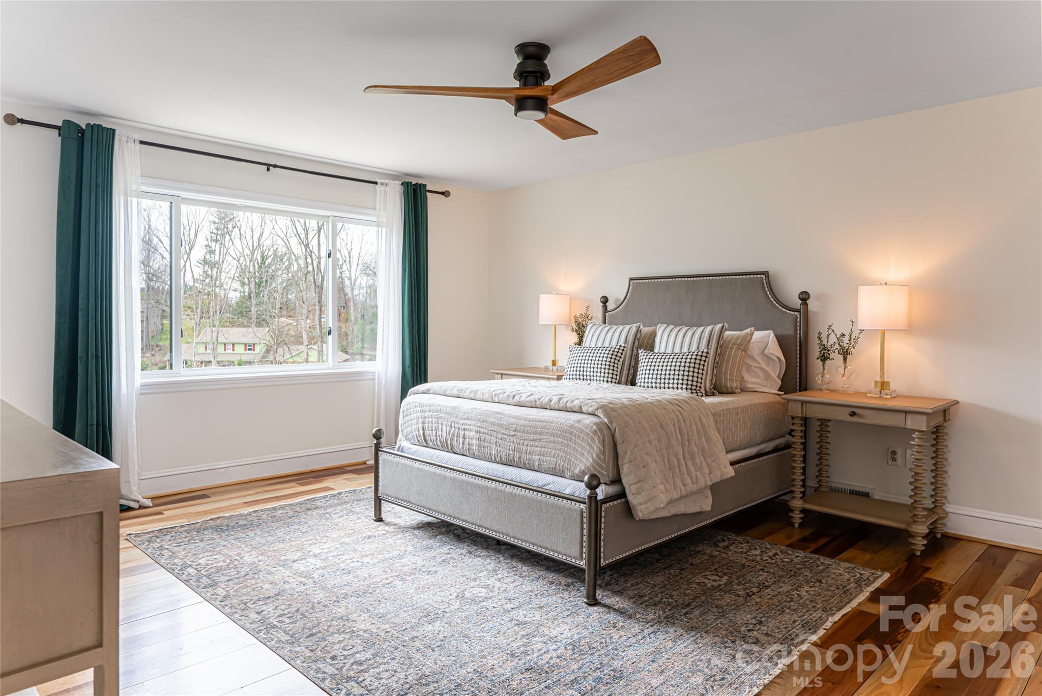 210 Wildflower Road Asheville, NC 28804 - Photo 28 of 46 a bedroom with a bed and a window