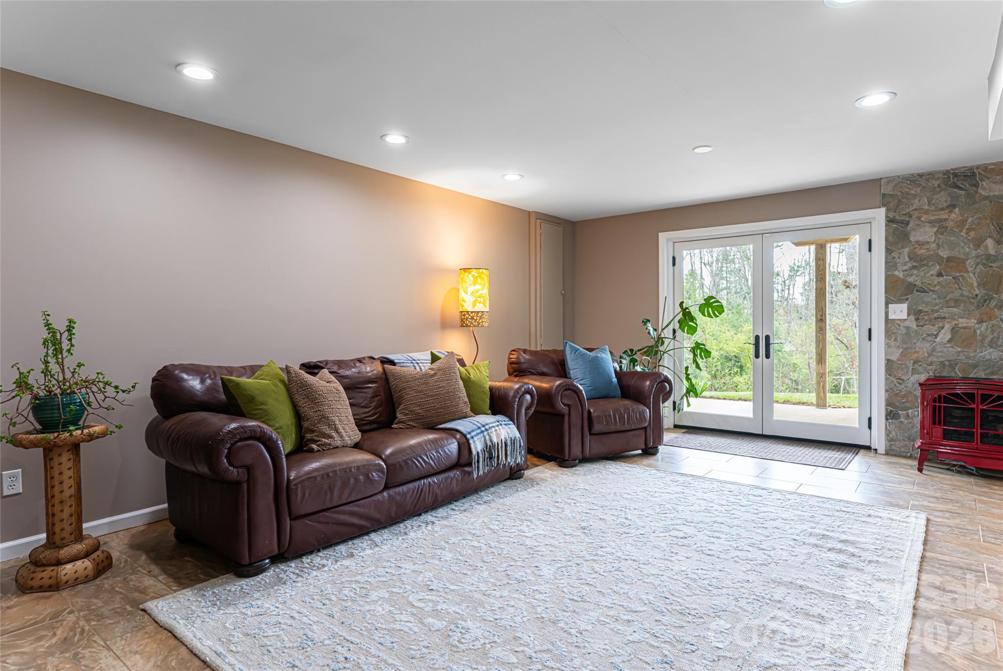 210 Wildflower Road Asheville, NC 28804 - Photo 33 of 46 a living room with furniture and a large window