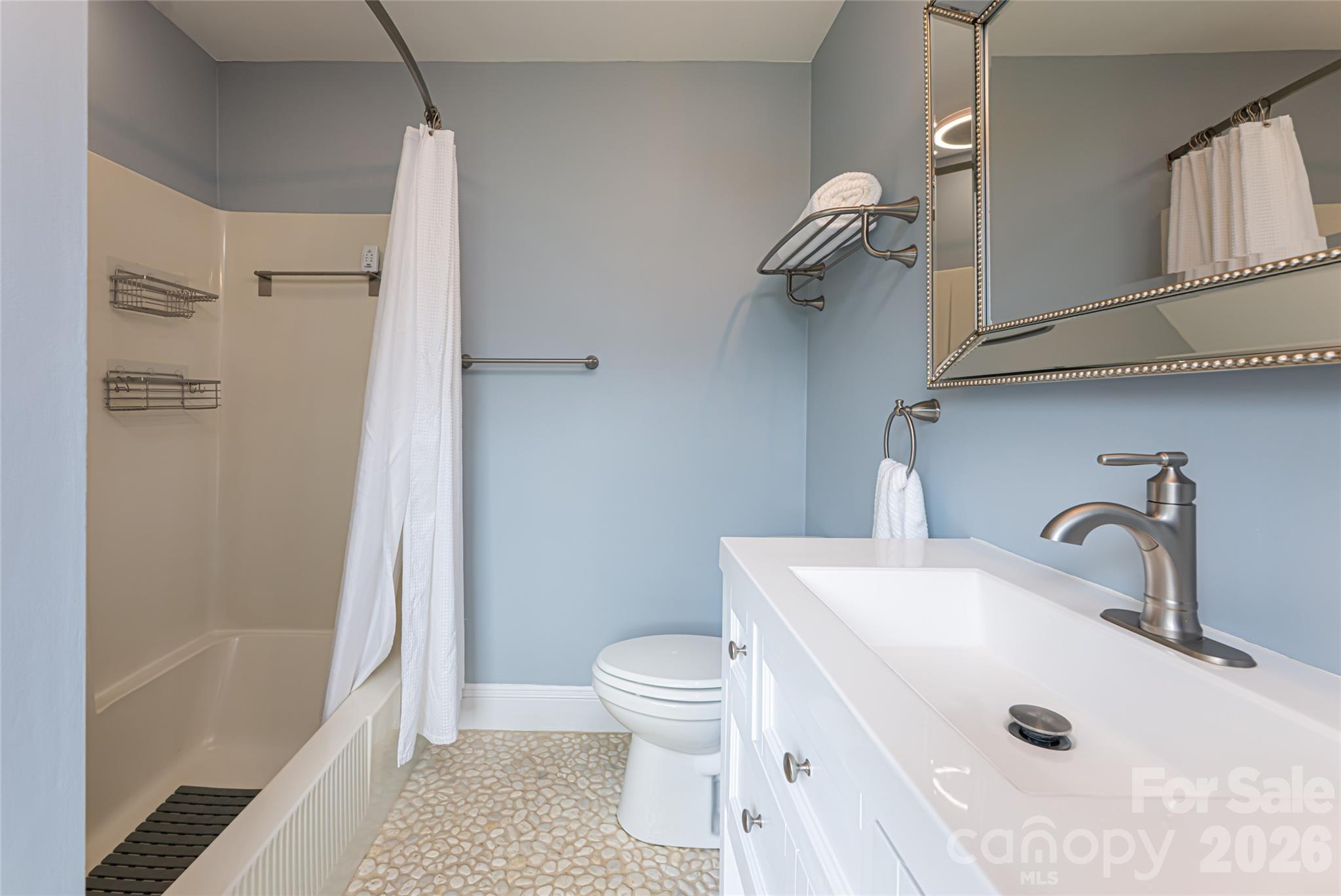 210 Wildflower Road Asheville, NC 28804 - Photo 36 of 46 a bathroom with a sink a toilet and shower