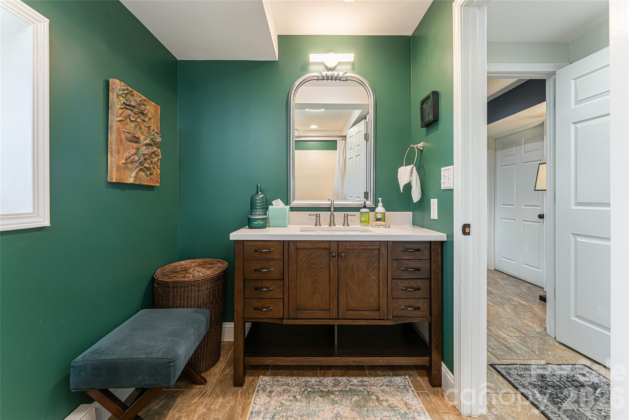 210 Wildflower Road Asheville, NC 28804 - Photo 37 of 46 a bathroom with a toilet sink and mirror
