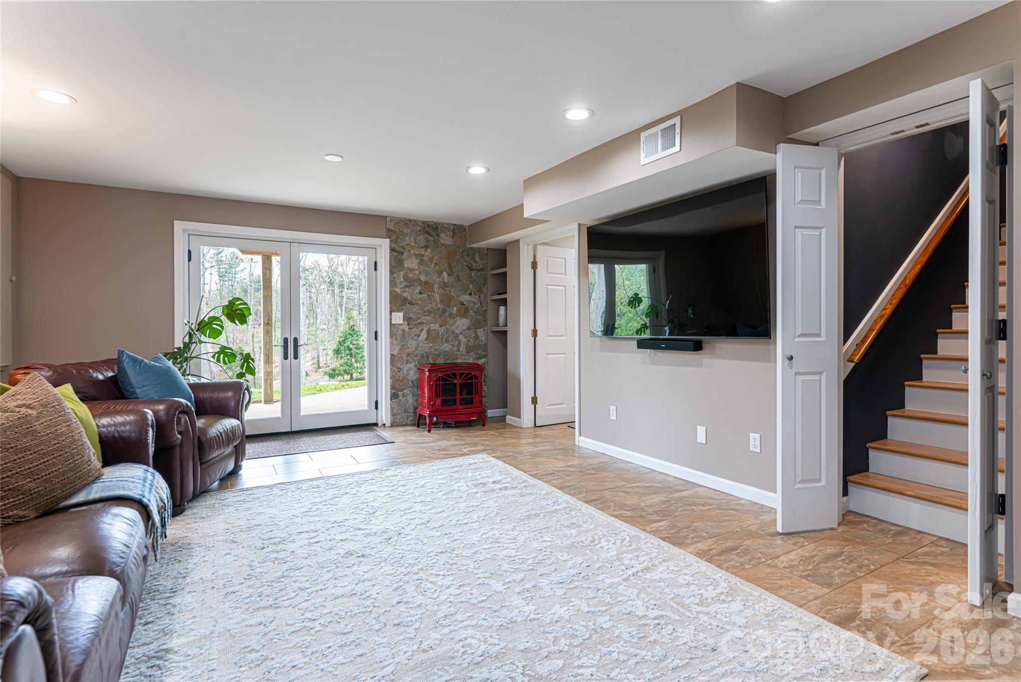 210 Wildflower Road Asheville, NC 28804 - Photo 38 of 46 a living room with furniture and a fireplace