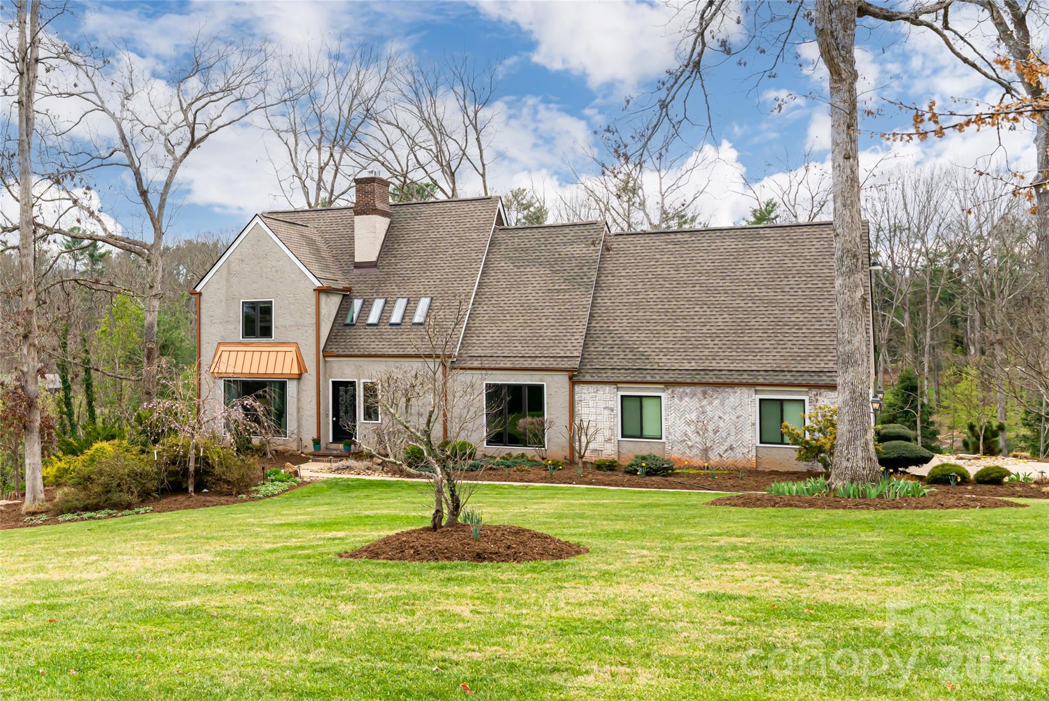 210 Wildflower Road Asheville, NC 28804 - Photo 45 of 46 a front view of a house with a garden