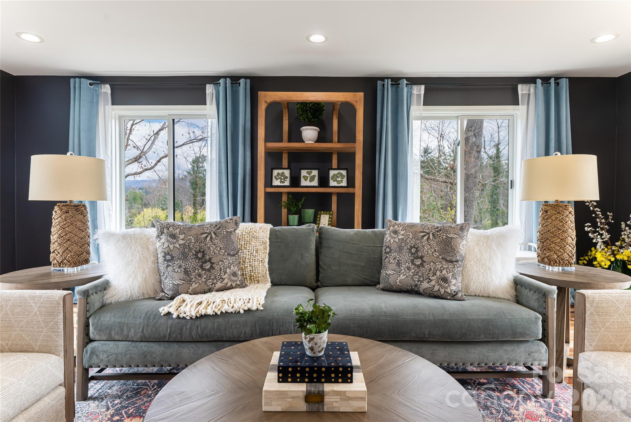 210 Wildflower Road Asheville, NC 28804 - Photo 8 of 46 a living room with furniture and a large window