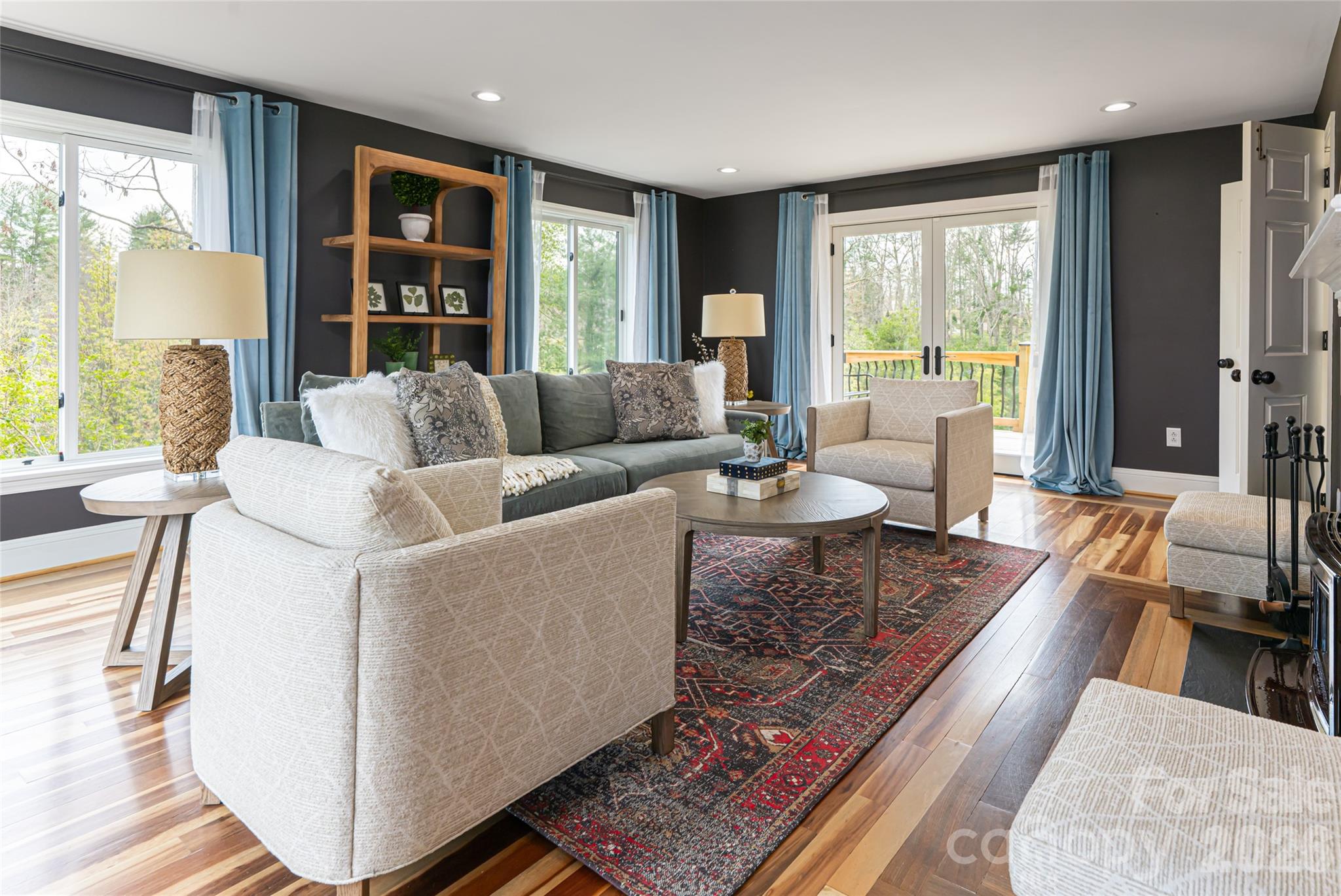 210 Wildflower Road Asheville, NC 28804 - Photo 10 of 46 a living room with furniture and large windows