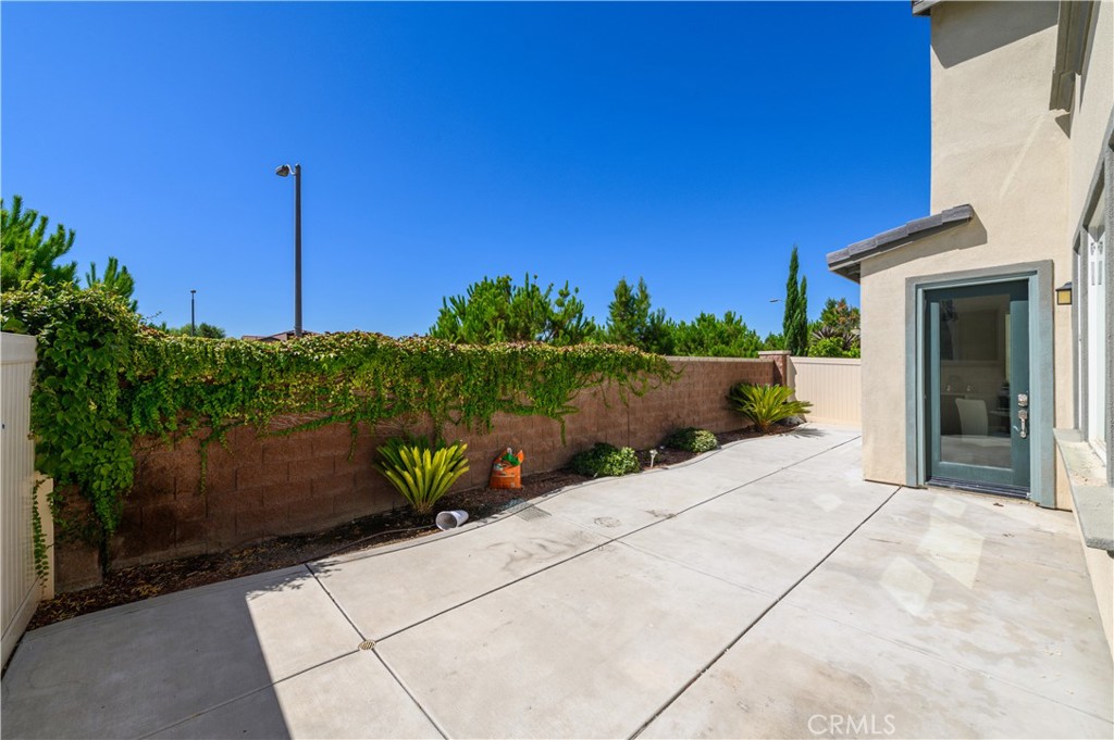 8825 Celebration Street Chino, CA 91708 - Photo 11 of 30 a view of a backyard with potted plants