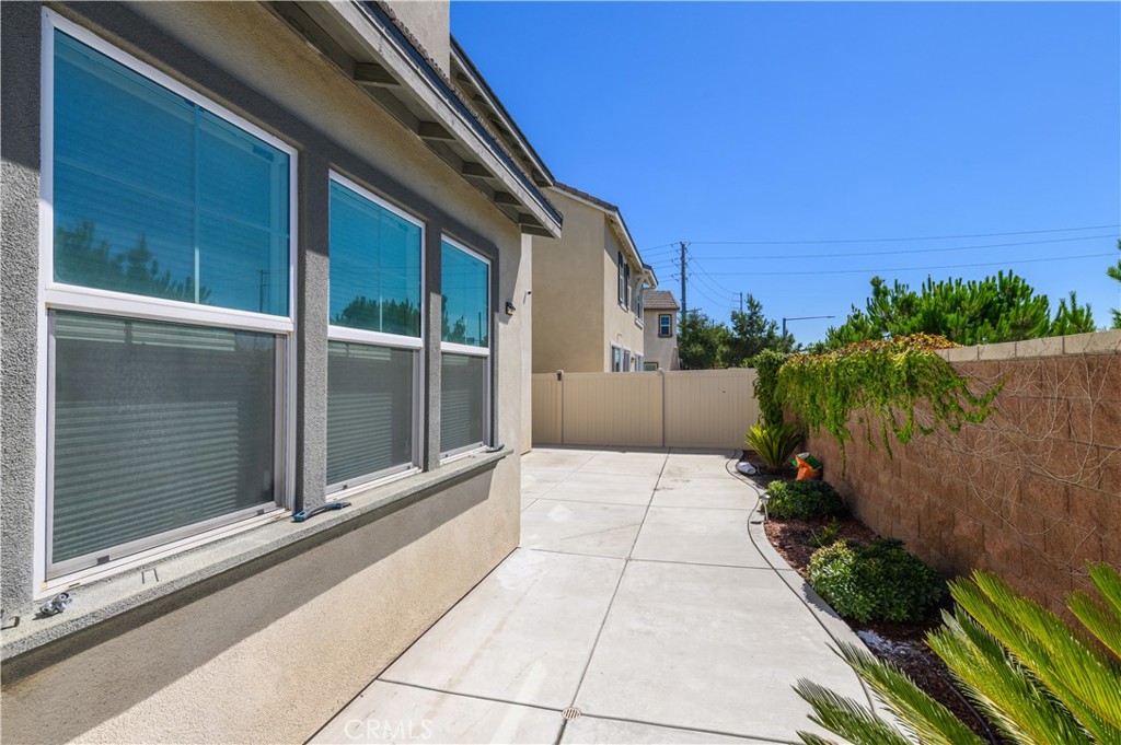 8825 Celebration Street Chino, CA 91708 - Photo 13 of 30 a view of backyard with potted plants