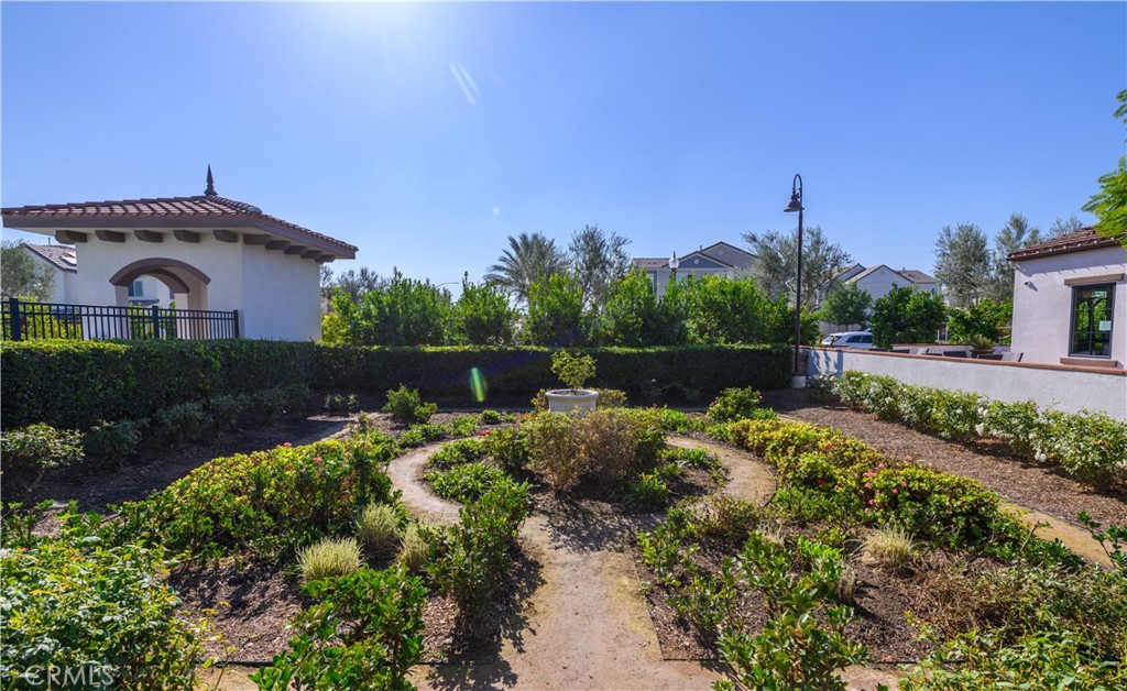 8825 Celebration Street Chino, CA 91708 - Photo 16 of 30 a front view of a house with a yard