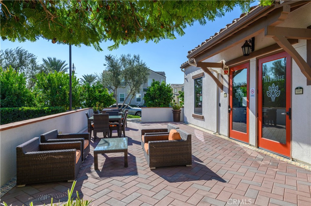8825 Celebration Street Chino, CA 91708 - Photo 21 of 30 a view of a patio with a dining table and chairs with wooden floor