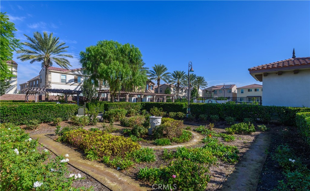 8825 Celebration Street Chino, CA 91708 - Photo 24 of 30 a view of a chair and tables in the garden