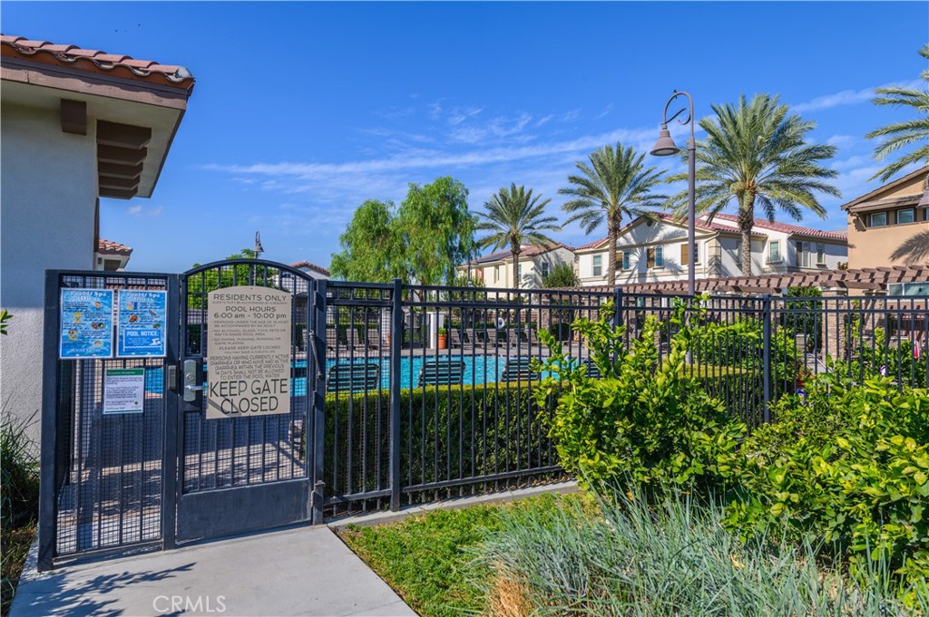 8825 Celebration Street Chino, CA 91708 - Photo 27 of 30 a view of a house with a small yard and plants