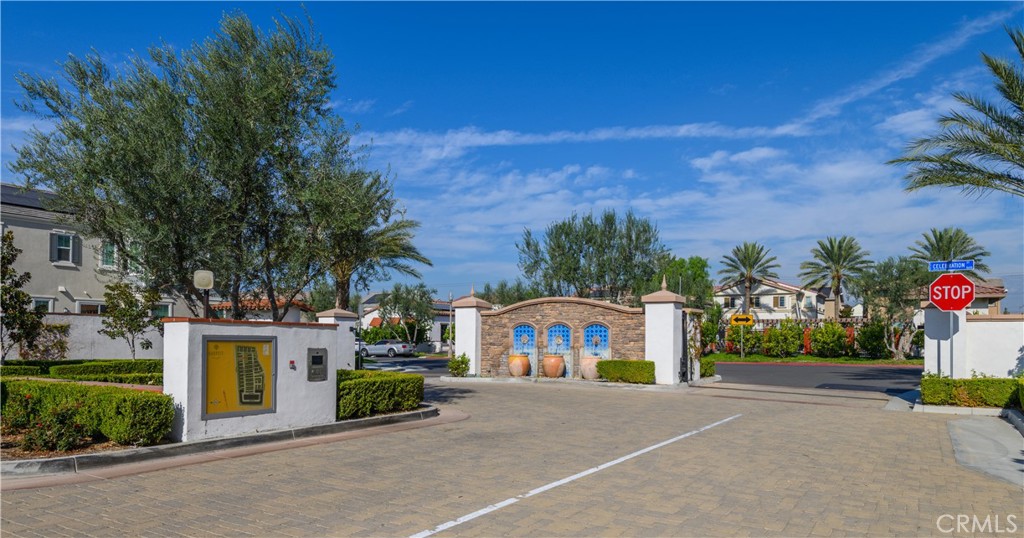 8825 Celebration Street Chino, CA 91708 - Photo 29 of 30 a front view of a house with a yard and garage