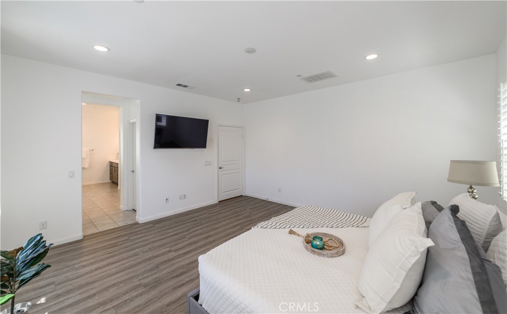 8825 Celebration Street Chino, CA 91708 - Photo 6 of 30 a living room with furniture and a flat screen tv