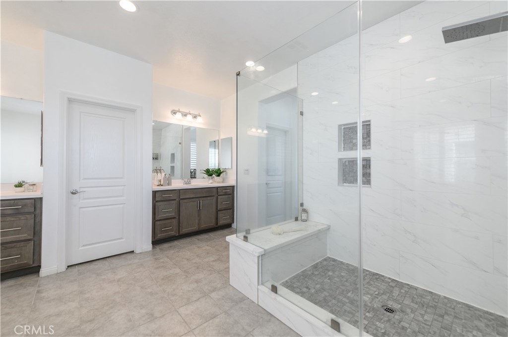 8825 Celebration Street Chino, CA 91708 - Photo 7 of 30 a bathroom with a sink a toilet and shower