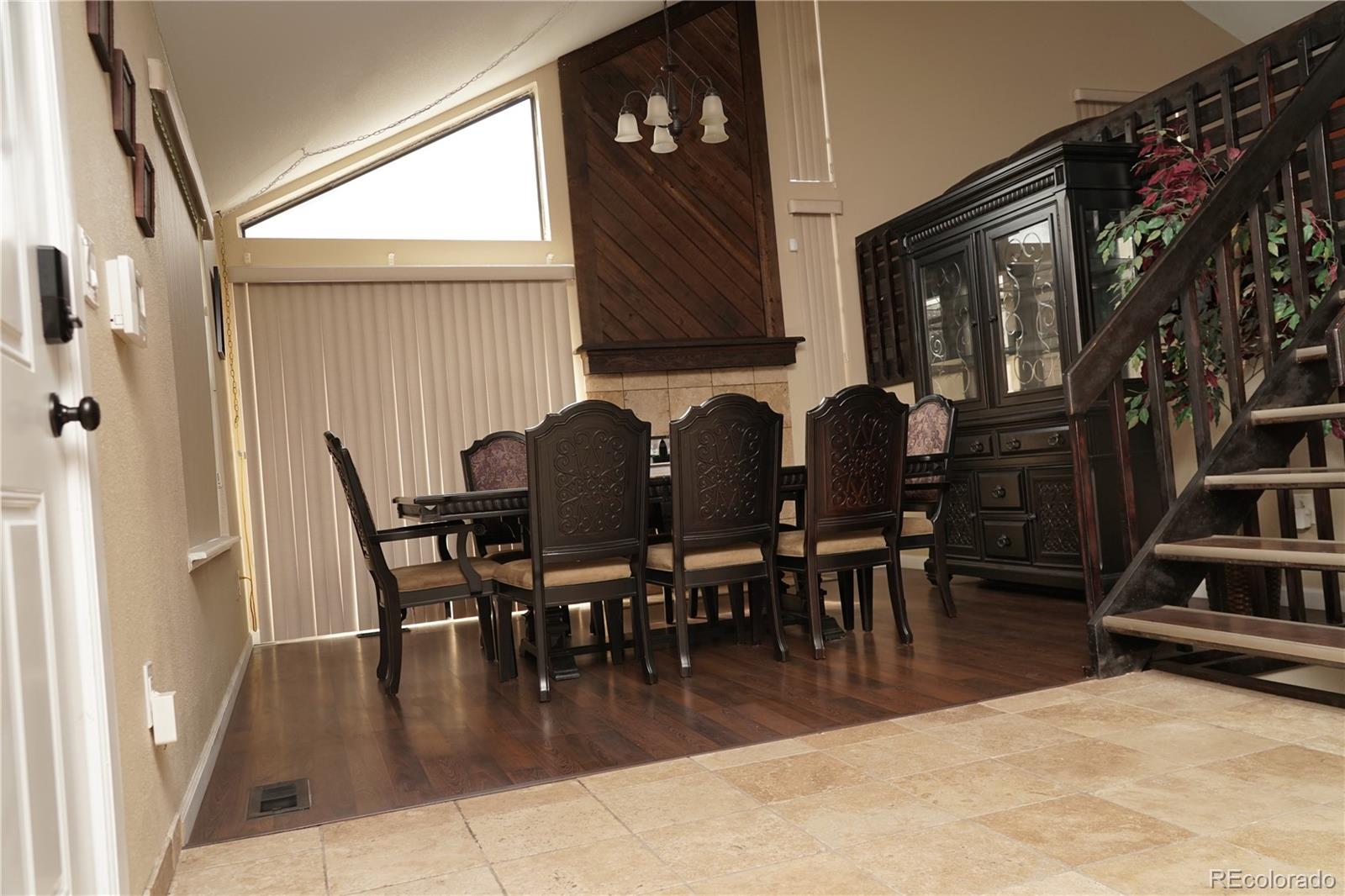 Undisclosed Address Aurora, CO 80017 - Photo 4 of 8 a dining room with furniture entryway and wooden floor