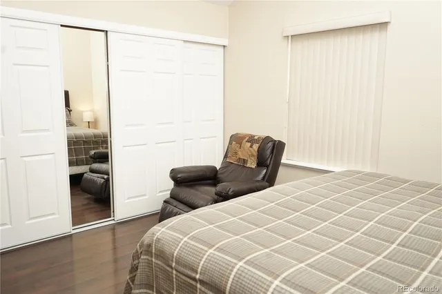 a bedroom with a bed and a shower