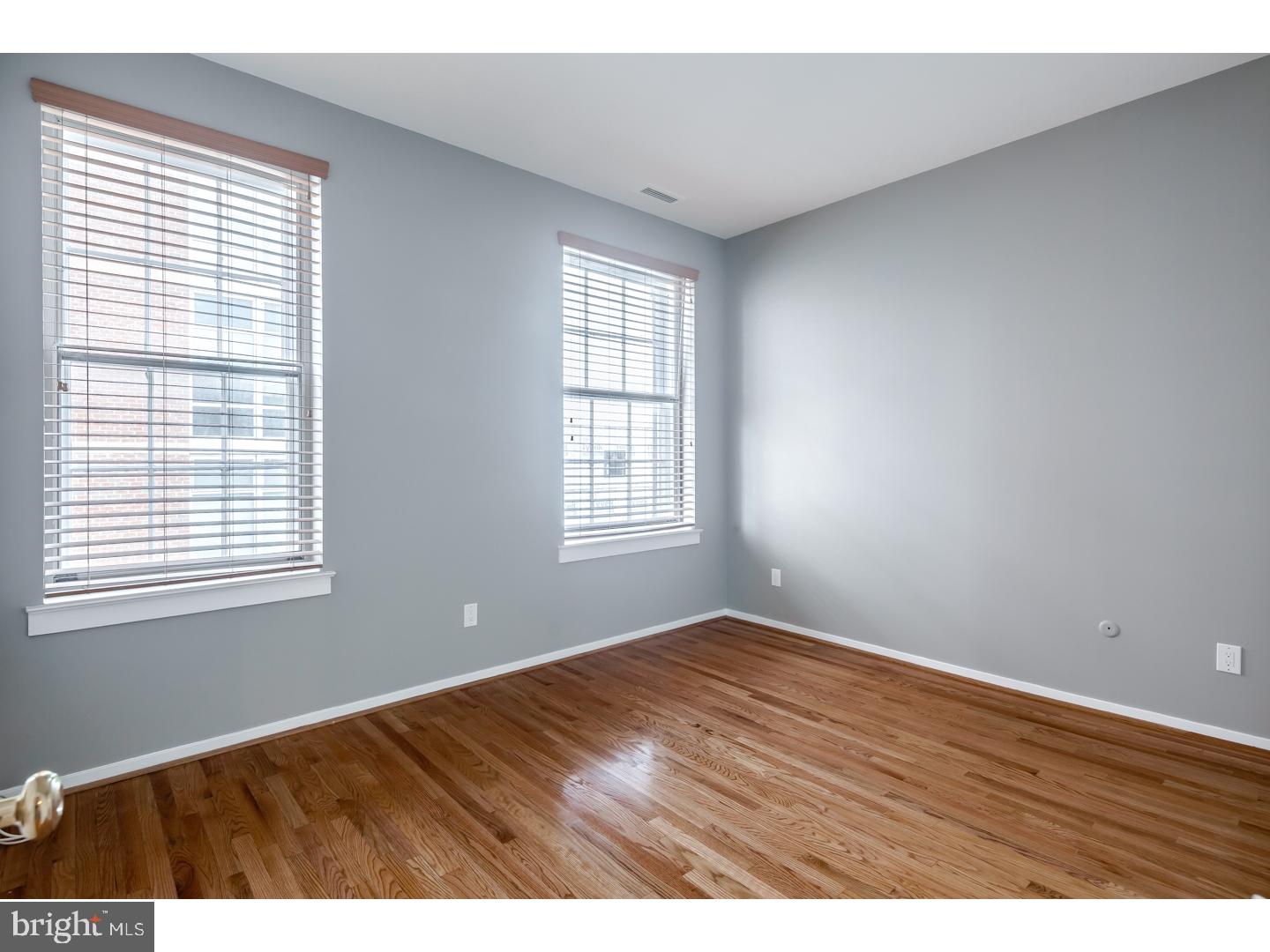 12-16 Letitia Street, Unit 503 Philadelphia, PA 19106 - Photo 11 of 12 a view of an empty room with wooden floor and a window