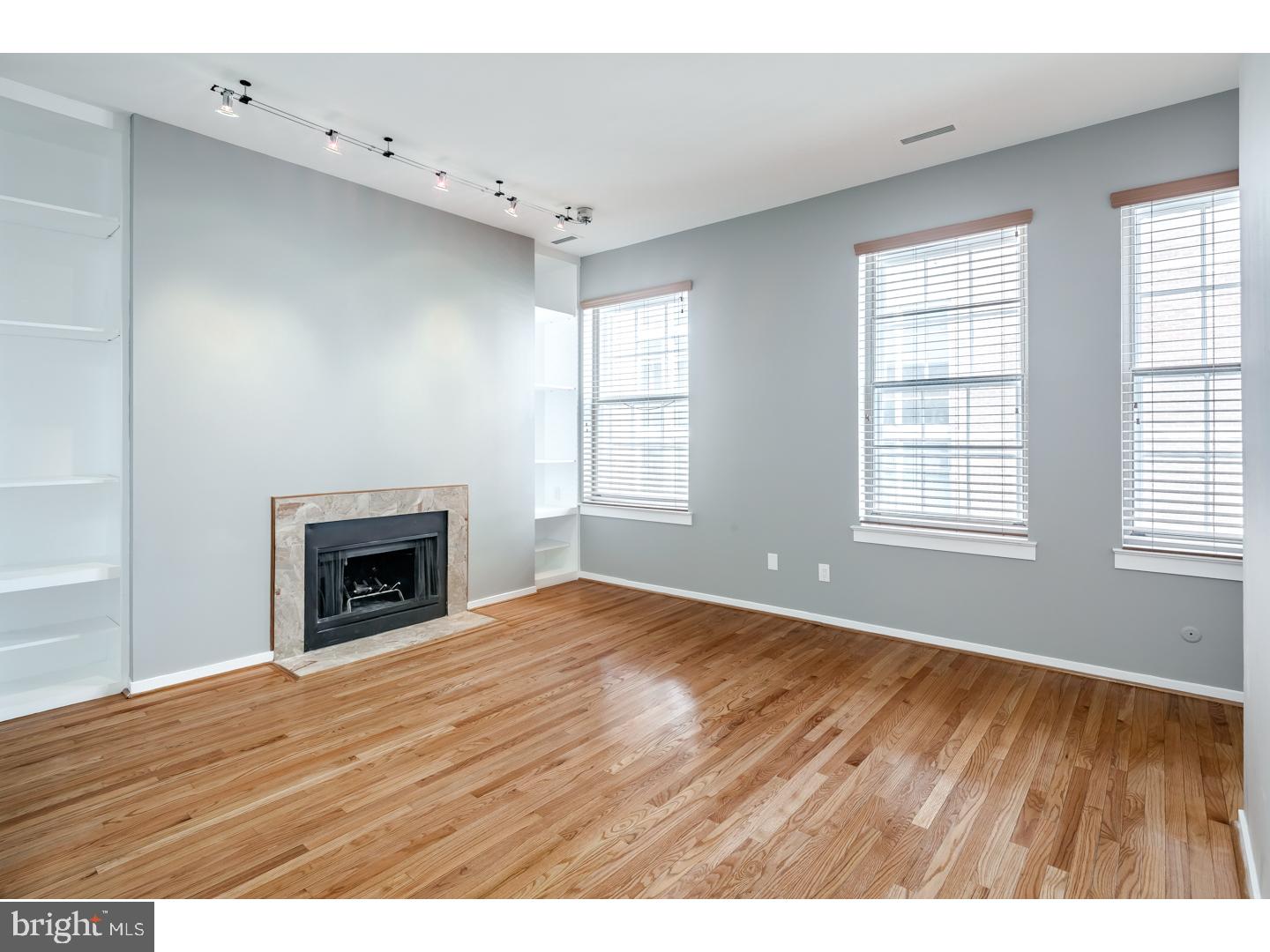 12-16 Letitia Street, Unit 503 Philadelphia, PA 19106 - Photo 4 of 12 a view of an empty room with wooden floor and a window