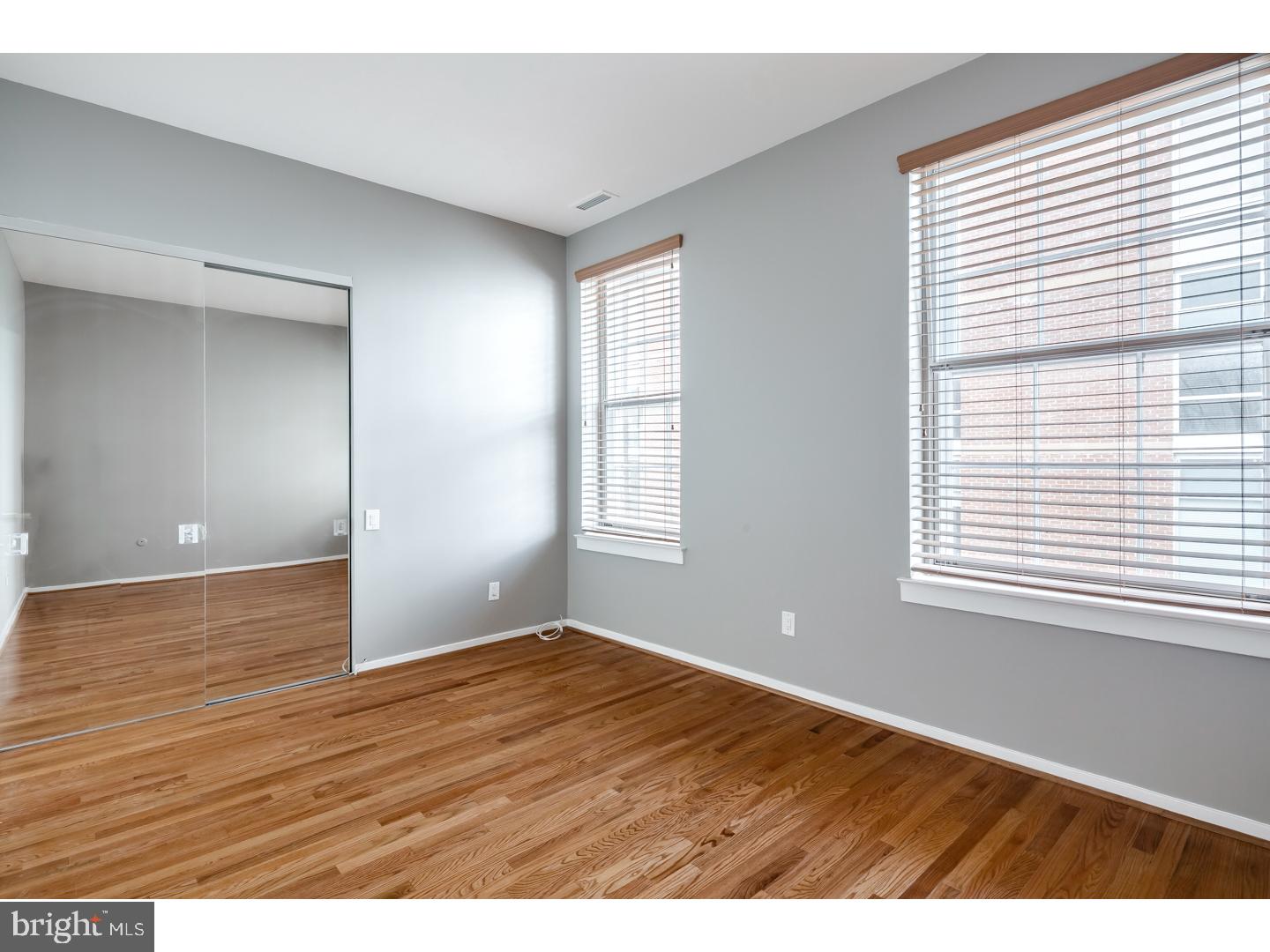 12-16 Letitia Street, Unit 503 Philadelphia, PA 19106 - Photo 10 of 12 a view of an empty room with wooden floor and a window