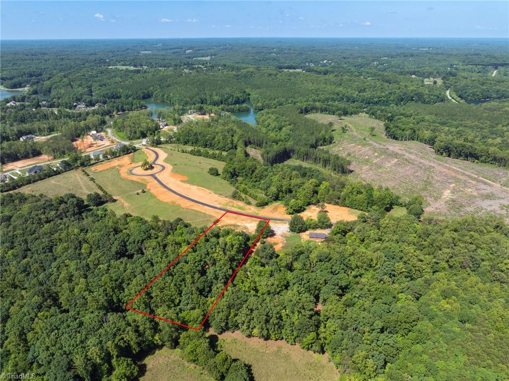 7289 Plunkett Road Stokesdale, NC 27357 - Photo 1 of 27 Approxinmately 5 acres lot located in Colwater with Amenities