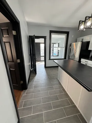 a view of room with window and hardwood floor