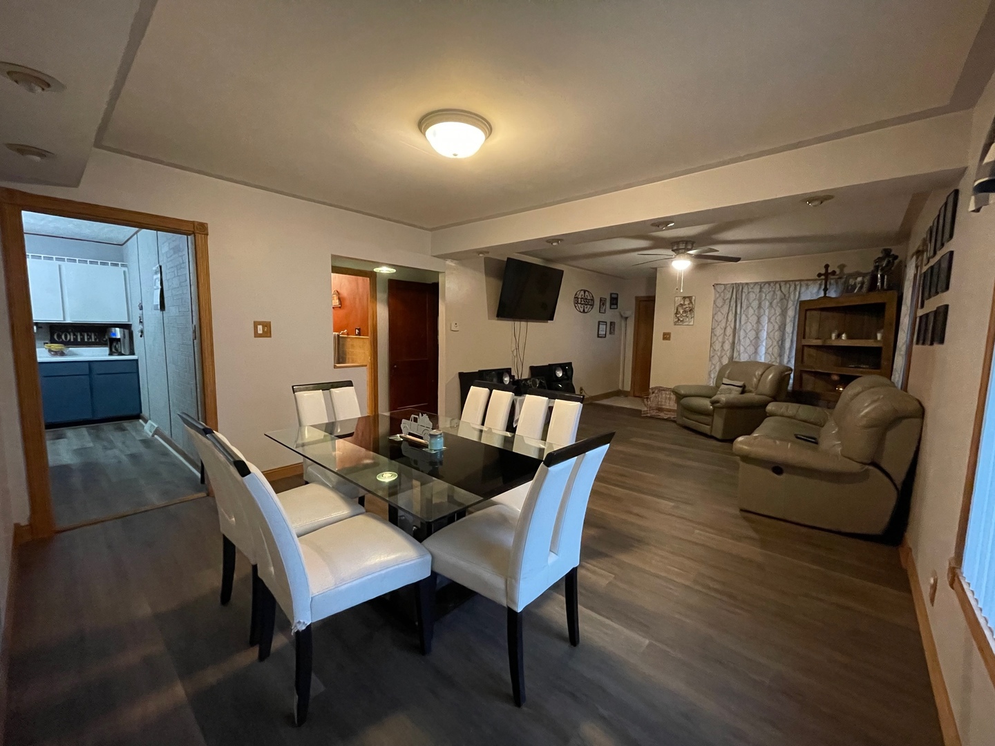 1202 2nd Avenue Rochelle, IL 61068 - Photo 4 of 13 a living room with furniture kitchen view and a wooden floor