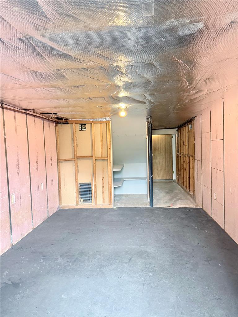 5540 Main Street Whitehall, PA 18052 - Photo 48 of 53 A partially finished basement with concrete flooring awaits your creative vision.