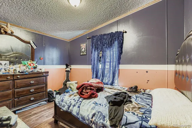 a bedroom with a bed and a mirror