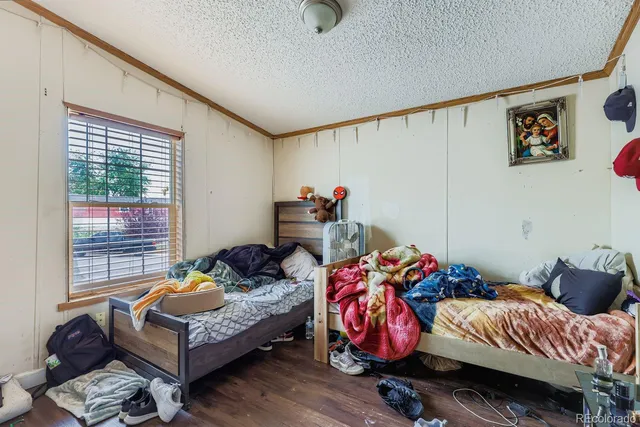 a bedroom with bed and a window