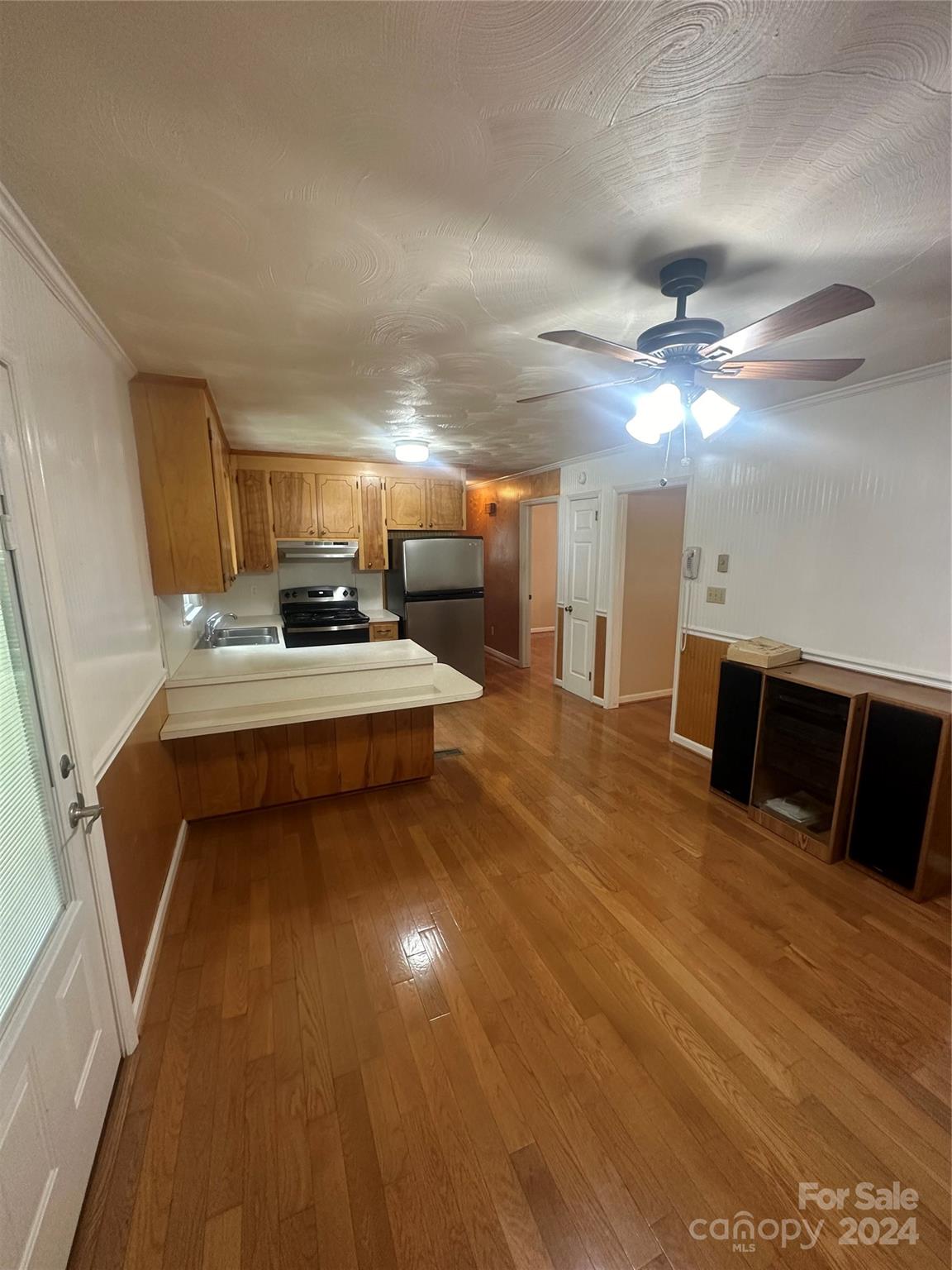 1854 Holland Drive Conover, NC 28613 - Photo 4 of 14 a room with stainless steel appliances kitchen island granite countertop a sink and cabinets