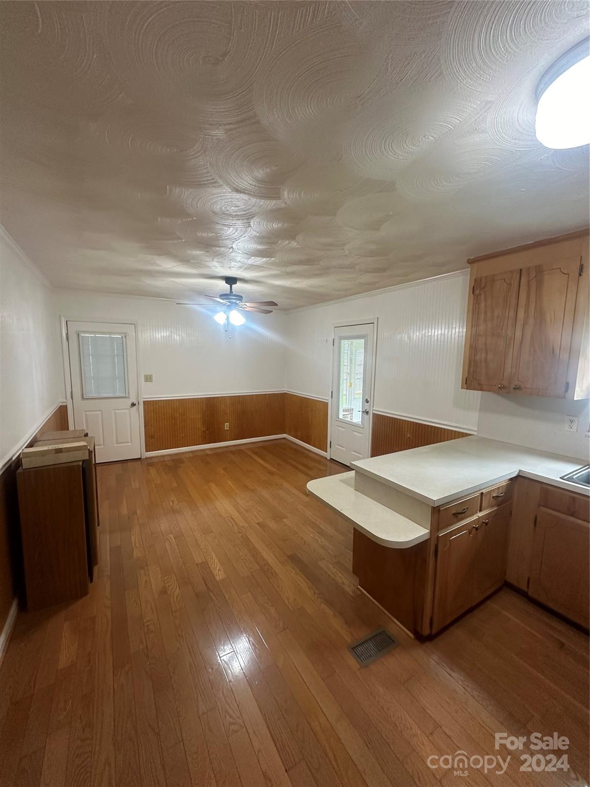 1854 Holland Drive Conover, NC 28613 - Photo 5 of 14 a kitchen with kitchen island cabinets and wooden floor
