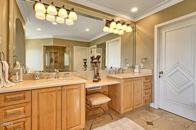 a bathroom with a sink double vanity and a mirror