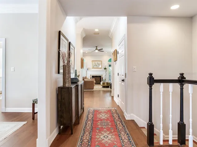 a kitchen with cabinets appliances and wooden floor