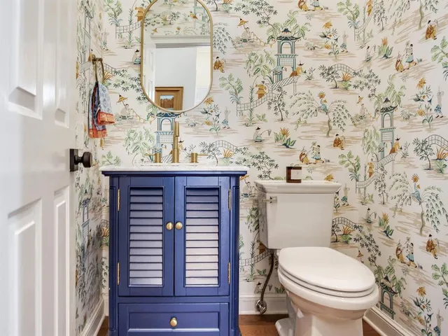 a living room with fireplace furniture and a flat screen tv