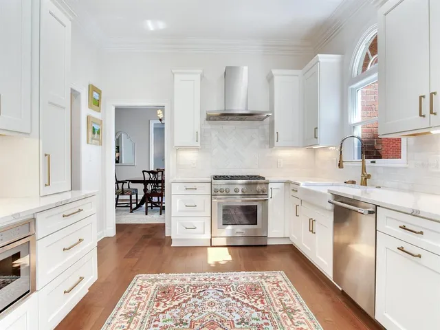 a wooden bench sitting in front of a building