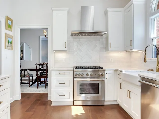 a view of entryway with furniture and wooden floor