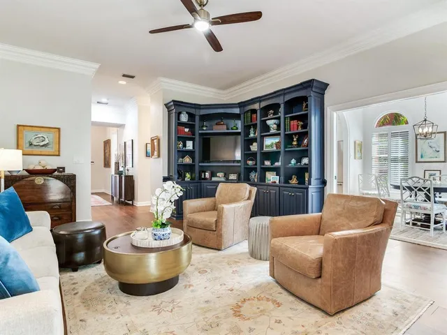 a bathroom with a double vanity sink toilet and shower