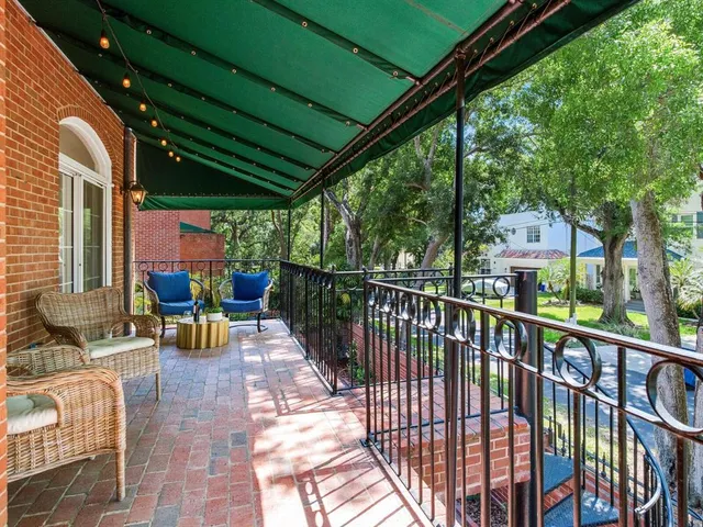 a bathroom with a granite countertop sink mirror and a toilet