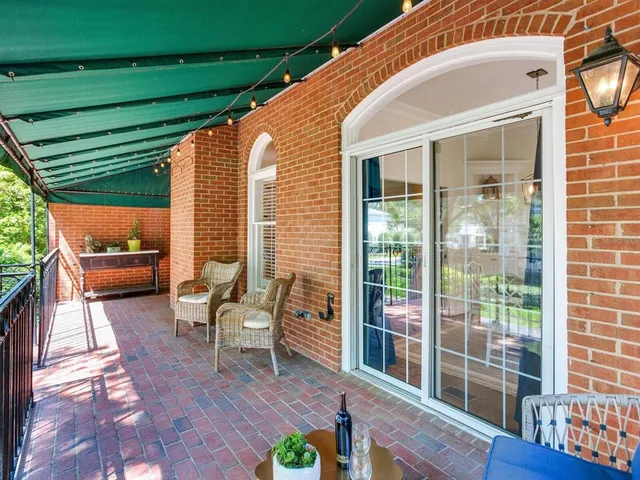 a bathroom with a glass shower door a sink and a mirror