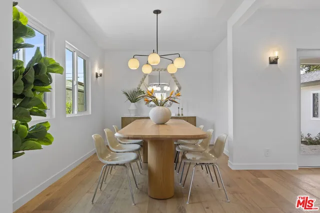 a dining room with a table and chairs