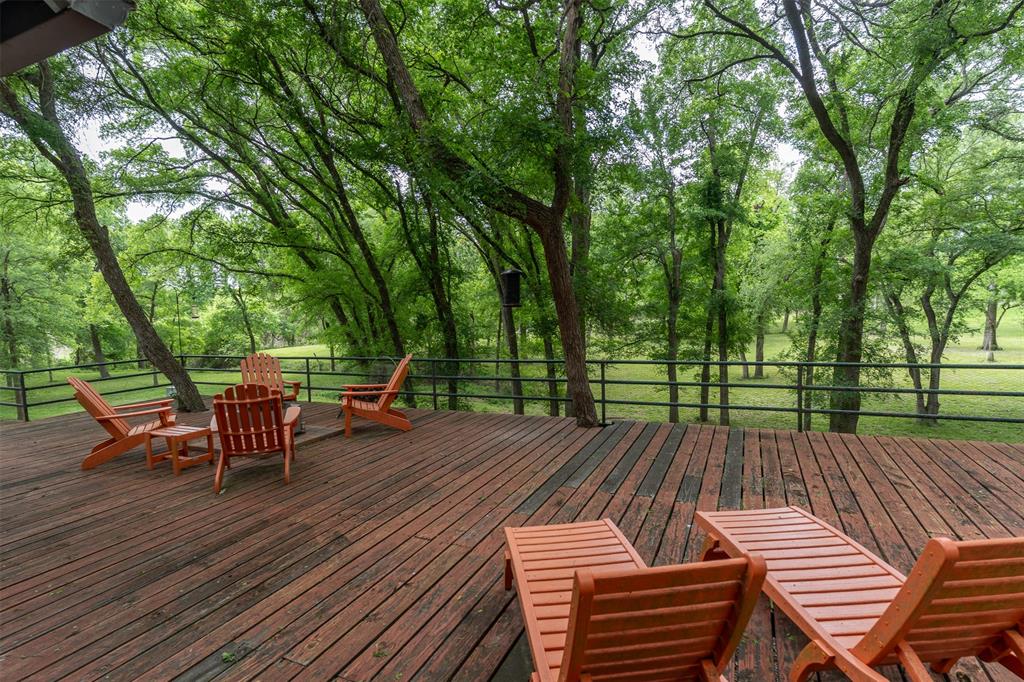 377 County Road 2530 Meridian, TX 76665 - Photo 13 of 25 a view of a wooden deck with furniture