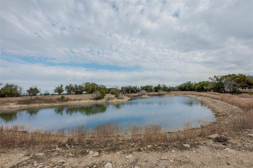 377 County Road 2530 Meridian, TX 76665 - Photo 17 of 25 a view of a lake with houses in the back