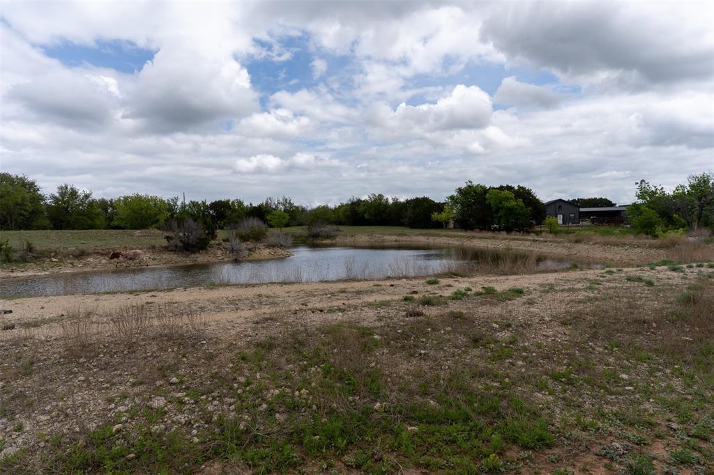 377 County Road 2530 Meridian, TX 76665 - Photo 18 of 25 a view of yard with lake and green space