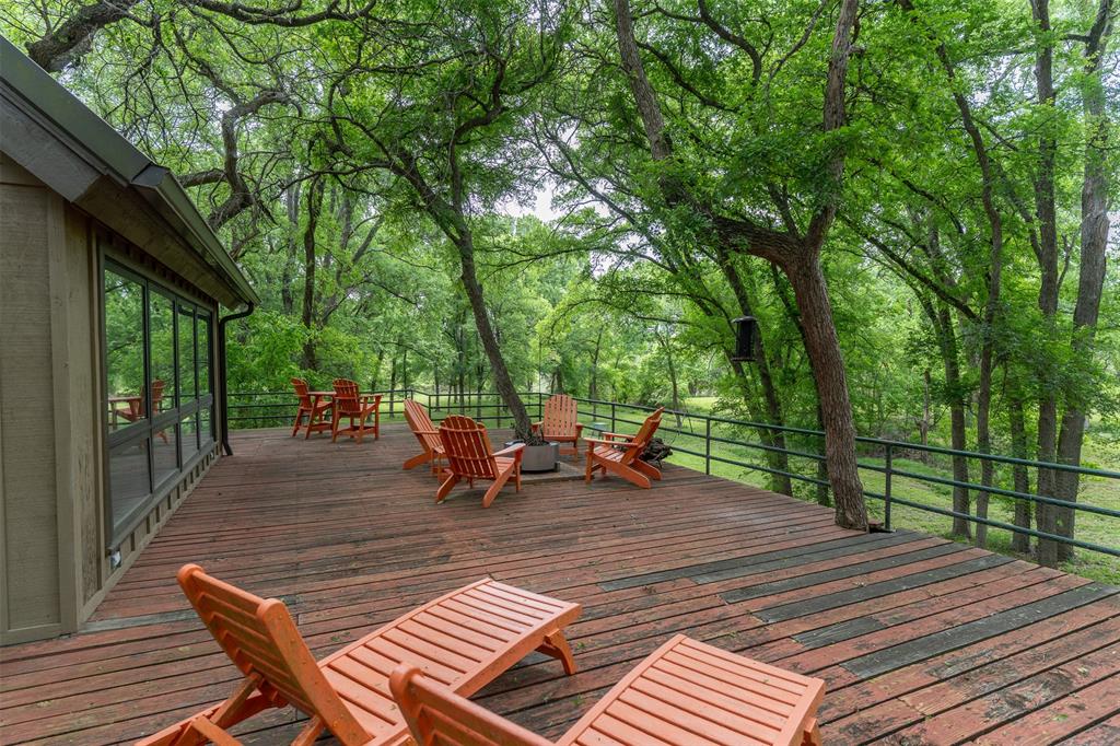 377 County Road 2530 Meridian, TX 76665 - Photo 2 of 25 a view of a wooden floor with chairs on the deck