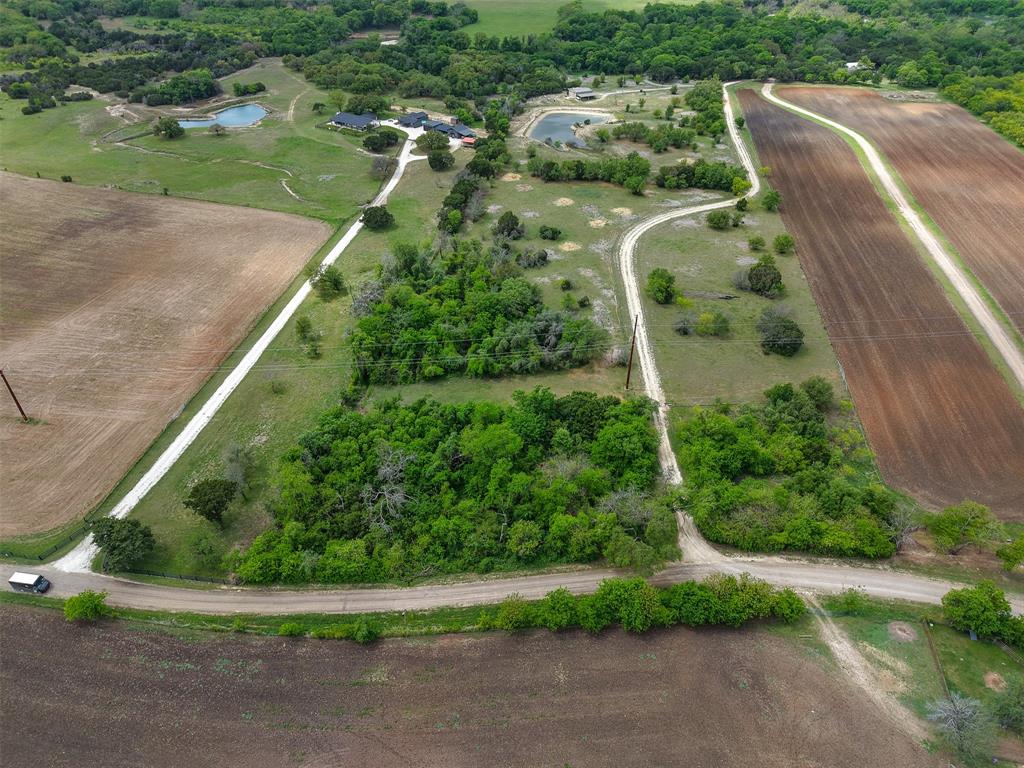 377 County Road 2530 Meridian, TX 76665 - Photo 6 of 25 a view of a garden with a houses