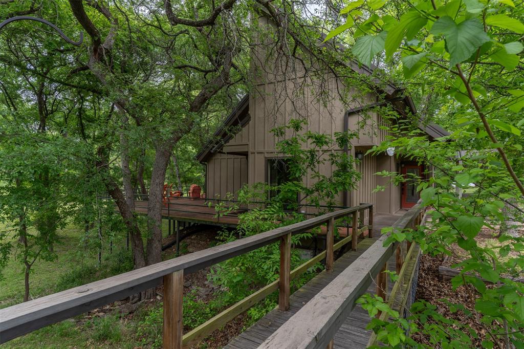 377 County Road 2530 Meridian, TX 76665 - Photo 7 of 25 a view of a house with large windows