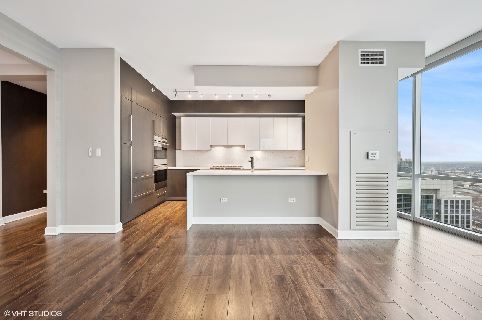 1201 South Prairie Avenue, Unit 4501 Chicago, IL 60605 - Photo 13 of 52 a view of kitchen with granite countertop cabinets and wooden floor