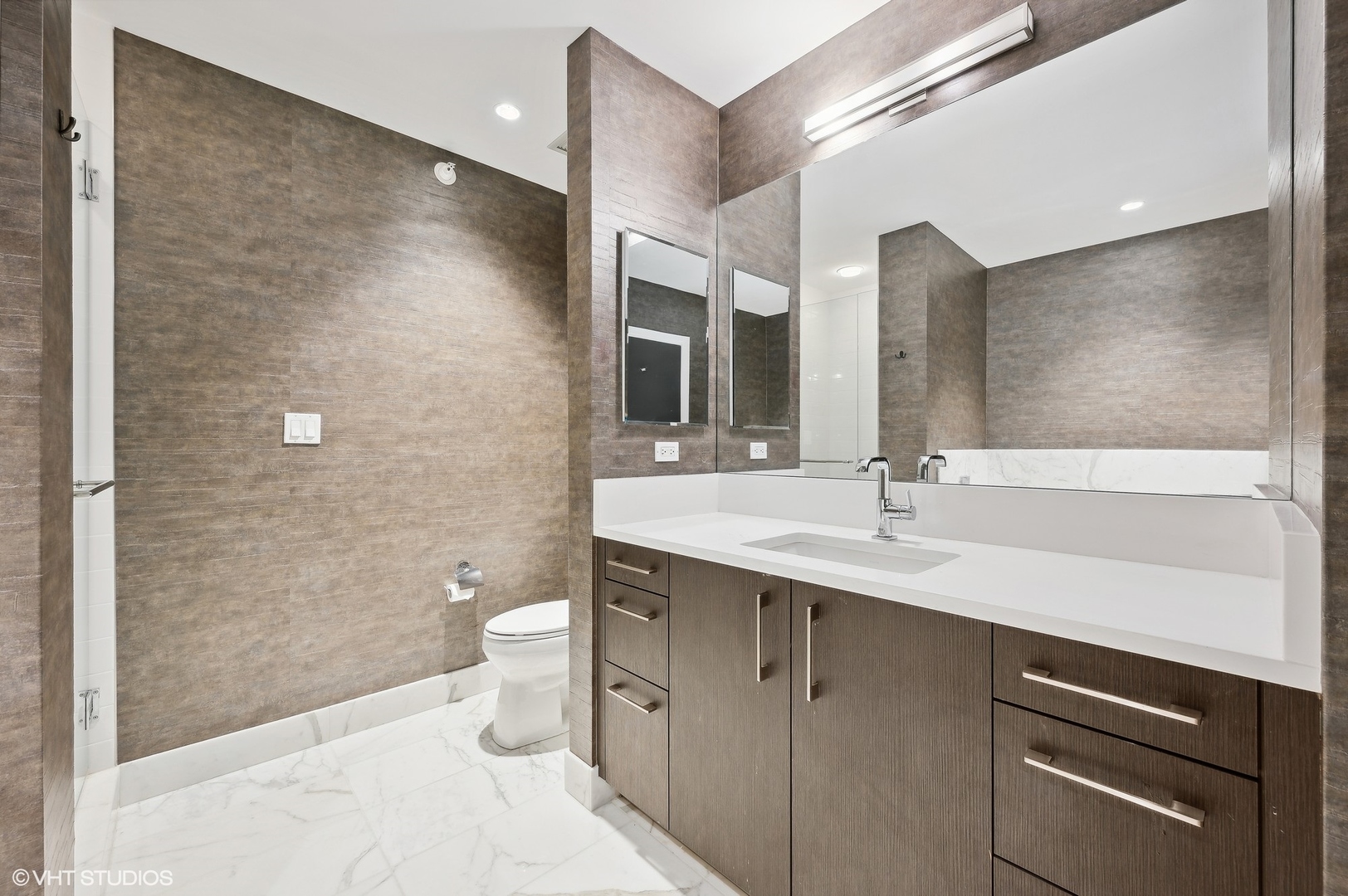 1201 South Prairie Avenue, Unit 4501 Chicago, IL 60605 - Photo 26 of 52 a bathroom with a double vanity sink toilet and a mirror