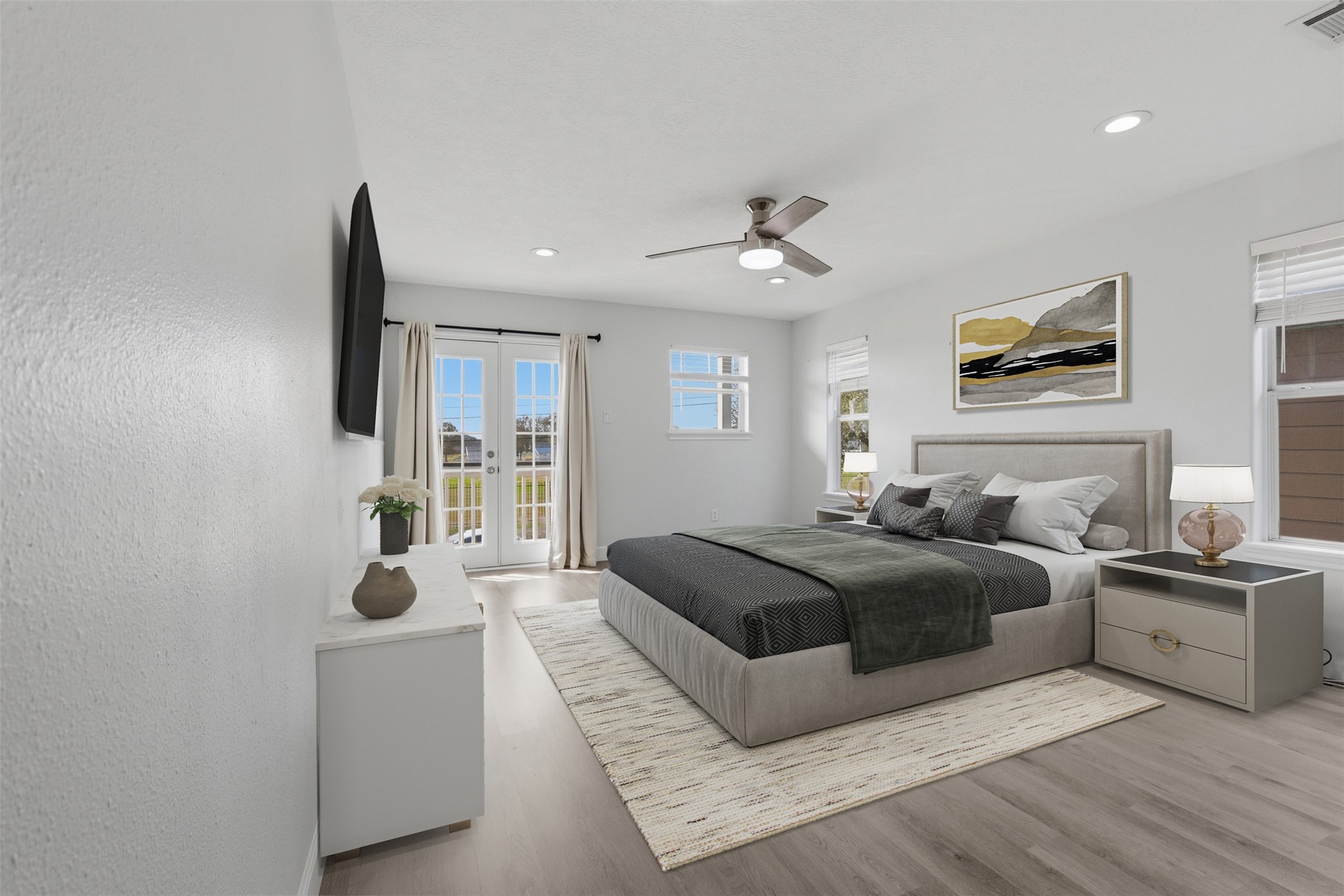 9026 McGallion Road Houston, TX 77022 - Photo 14 of 35 a spacious bedroom with a large bed and a window