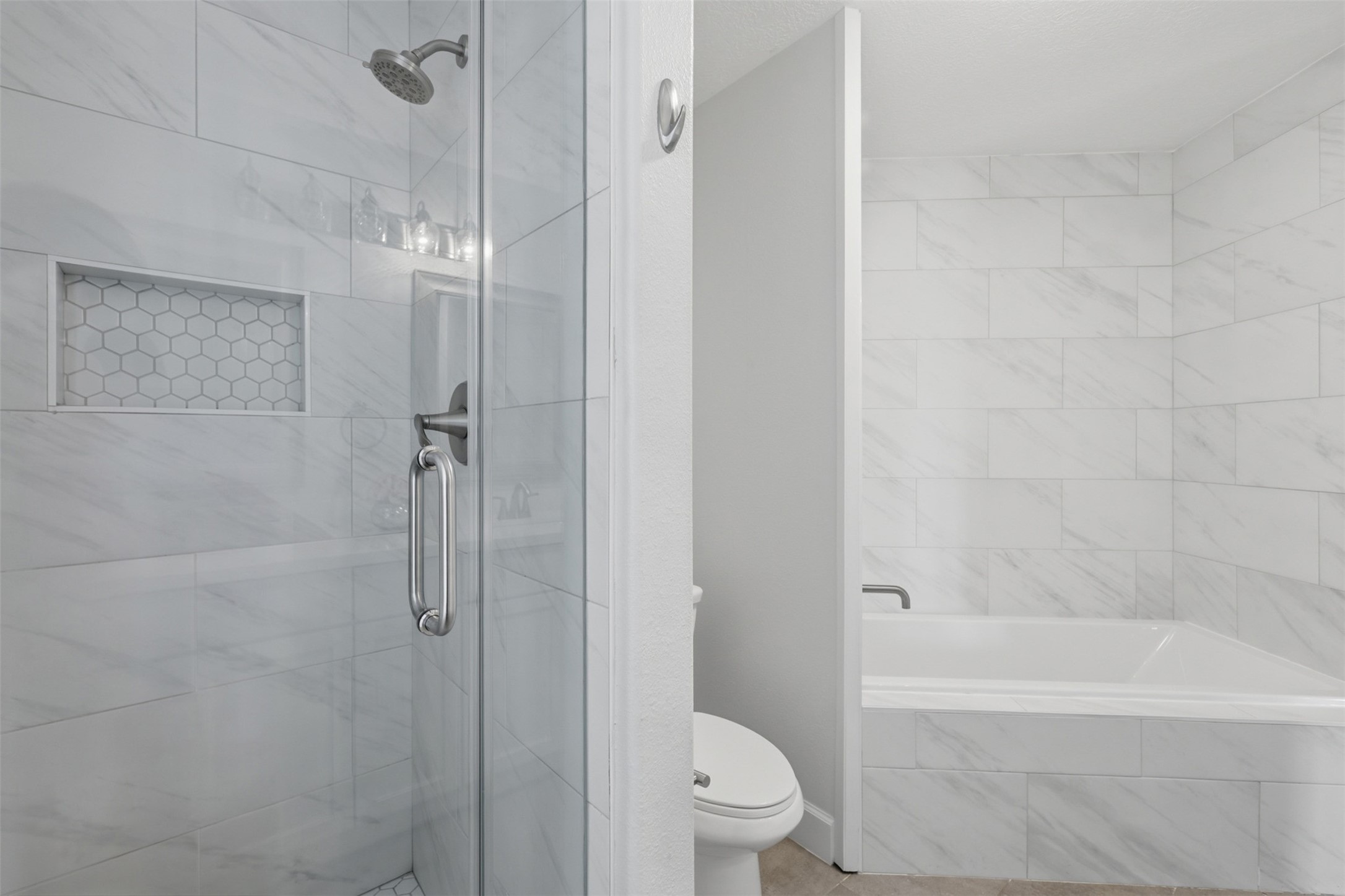 9026 McGallion Road Houston, TX 77022 - Photo 22 of 35 a bathroom with a shower a toilet and a shower