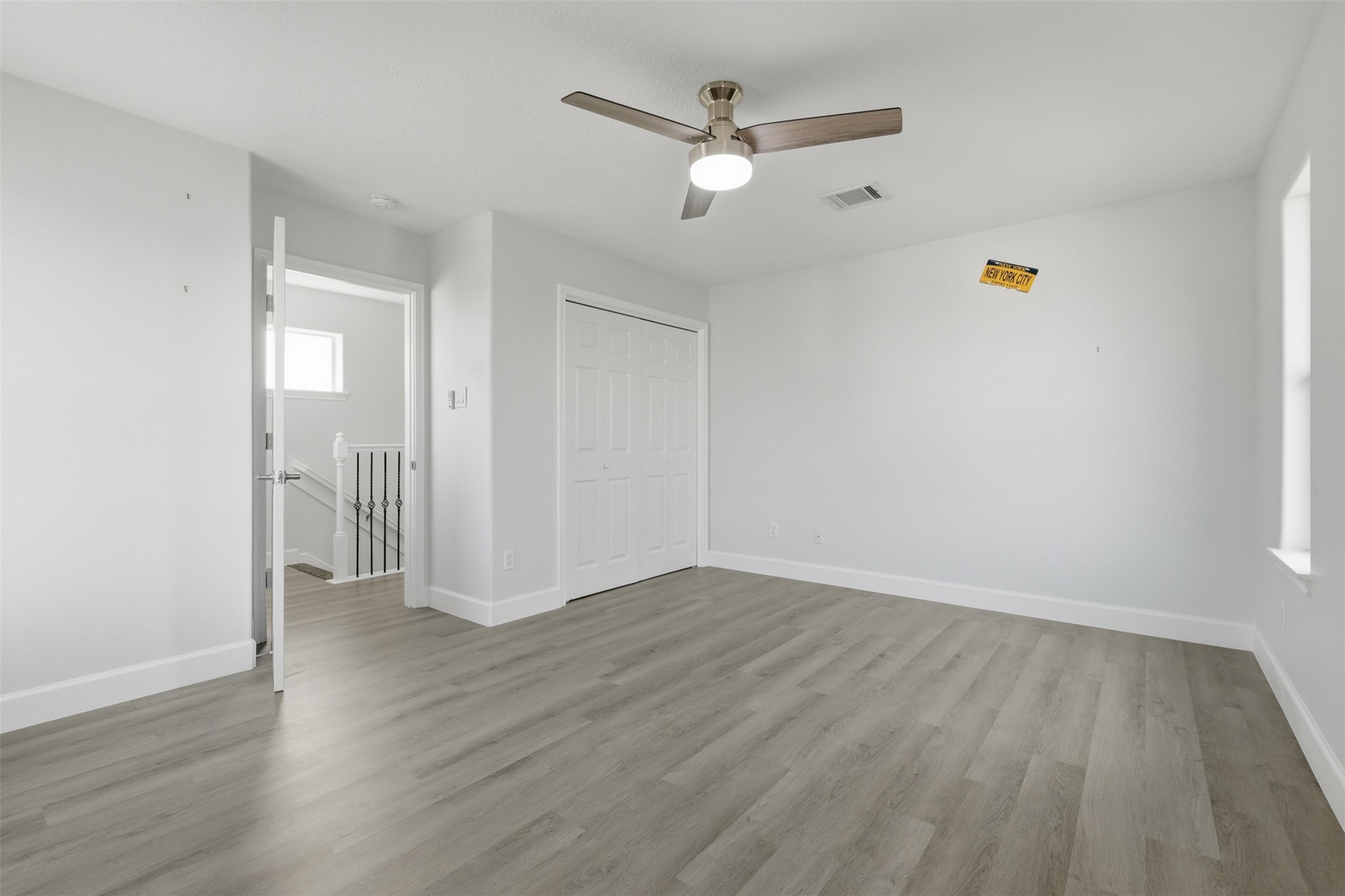 9026 McGallion Road Houston, TX 77022 - Photo 25 of 35 a view of an empty room and wooden floor